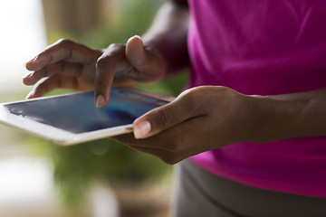 Image showing african american woman using tablet