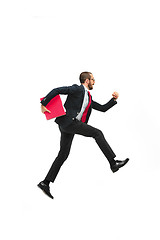 Image showing Businessman running with a folder on white background