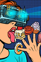 Image showing woman in virtual reality glasses eating sweets