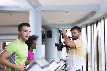 Image showing people exercisinng a cardio on treadmill in gym