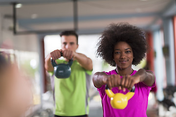 Image showing couple  workout with weights at  crossfit gym