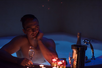 Image showing man relaxing in the jacuzzi