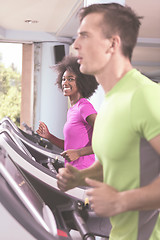 Image showing people exercisinng a cardio on treadmill