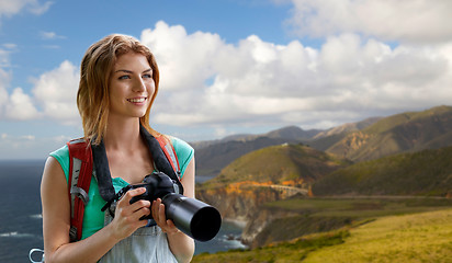 Image showing woman with backpack and camera at big sur coast