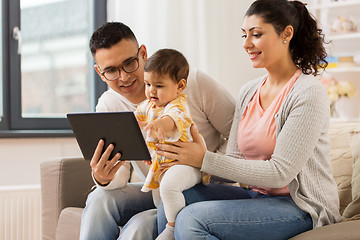 Image showing mother, father and baby with tablet pc at home