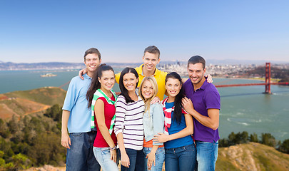 Image showing group of happy friends over golden gate bridge