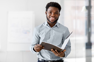 Image showing african american businessman with folder at office