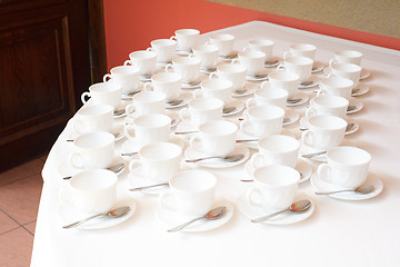 Image showing Group of white coffee cups in cafe bar