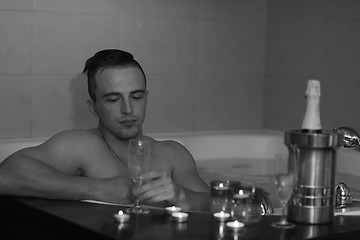 Image showing man relaxing in the jacuzzi