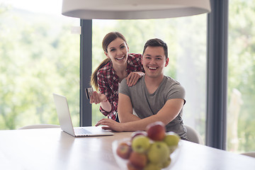 Image showing happy young couple buying online