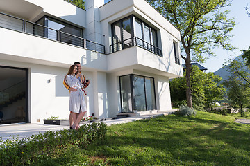 Image showing Young beautiful couple in bathrobes