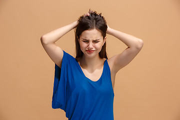 Image showing Beautiful woman in stress isolated on pastel