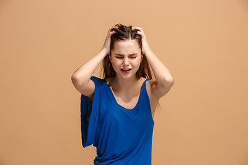 Image showing Beautiful woman in stress isolated on pastel