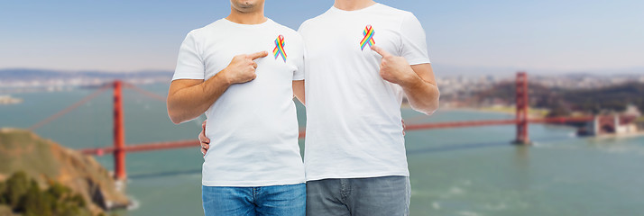 Image showing close up of couple with gay pride rainbow ribbons