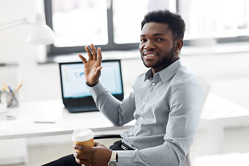 Image showing african american businessman with coffee at office