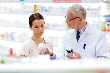 Image showing apothecary and woman with drug at pharmacy