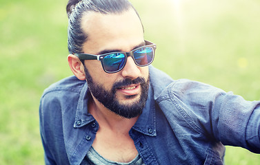 Image showing man in sunglasses at city street or park