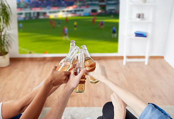 Image showing friends clinking beer and watching soccer game