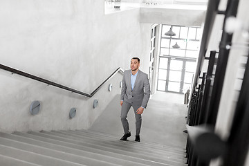 Image showing businessman walking upstairs