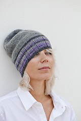 Image showing Beautiful woman in warm grey beanie hat.