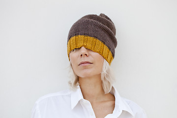 Image showing Beautiful woman in warm brown beanie hat.