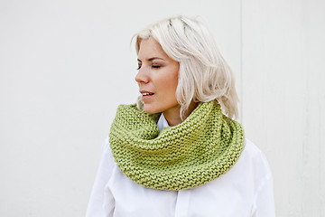 Image showing Woman in warm green wool knitted snood.