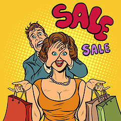 Image showing husband and wife on sale shopping