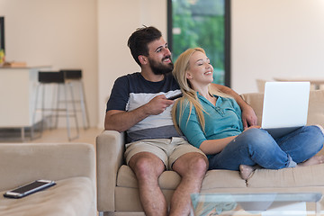 Image showing young happy couple relaxes in the living room