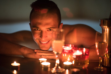 Image showing man relaxing in the jacuzzi