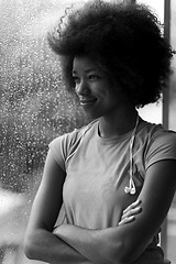 Image showing portrait of young afro american woman in gym while listening mus