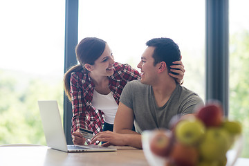 Image showing happy young couple buying online