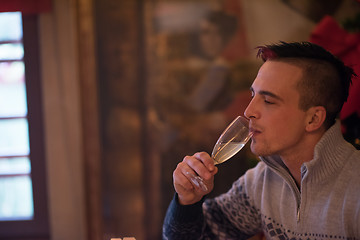 Image showing Happy young man with a glass of champagne