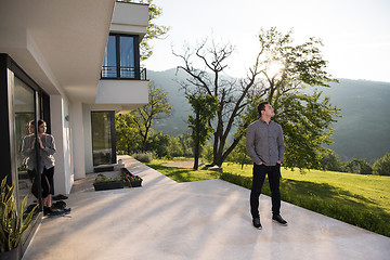 Image showing man in front of his luxury home villa