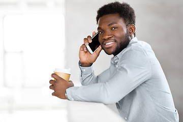 Image showing businessman calling on smartphone at office