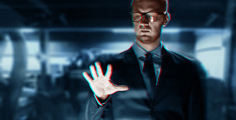 Image showing close up of businessman with something invisible