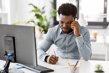 Image showing businessman calling on smartphone at office