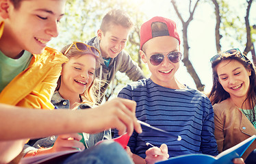 Image showing group of students with notebooks at school yard