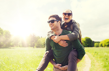 Image showing happy couple with backpacks having fun outdoors