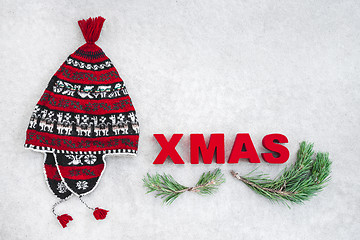 Image showing Xmas theme with red winter hat and pine branches