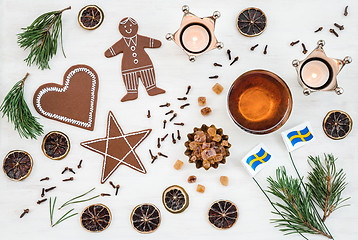 Image showing Swedish Christmas decor with flags, candles and ginger biscuits