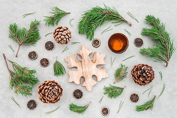 Image showing Christmas decor with pine tree branches and teacup