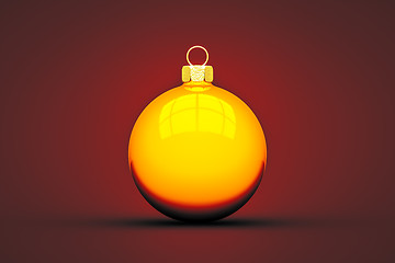 Image showing yellow Christmas ball isolated on red background