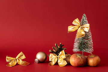 Image showing Christmas decoration with a fir tree on red background