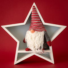 Image showing Christmas decoration white star with a gnome inside