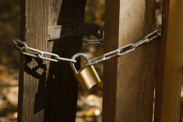 Image showing Old gate with padlock