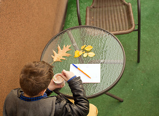 Image showing Boy eating sweets