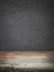 Image showing wooden table and grey wall