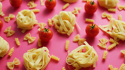 Image showing Uncooked pasta with fresh tomatoes