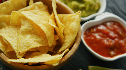 Image showing Nachos served with dip sauces 