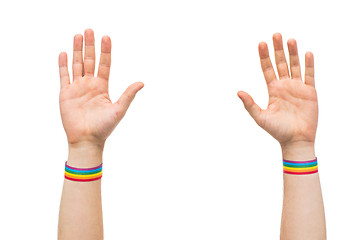 Image showing hands with gay pride rainbow wristbands